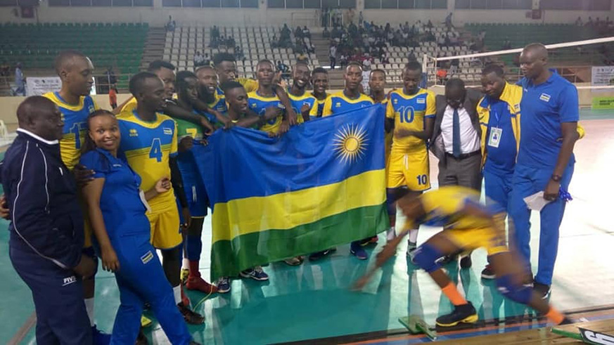 Rwandan players the coaching staff celebrate after edging out Cameroon to reach semis on Friday night. Courtesy.