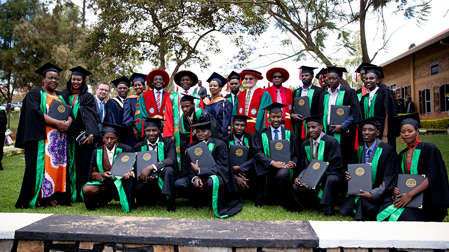 Someof the graduates in a group photo with the universityu2019s leadership. Frederic Byumvuhore.