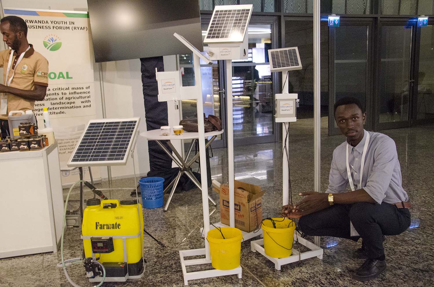 Arsene Simbi, the team leader of STES Group young innovators, showing how the solar-powered soil test and irrigation system works on August 21, 2018  in Kigali. Courtesy.