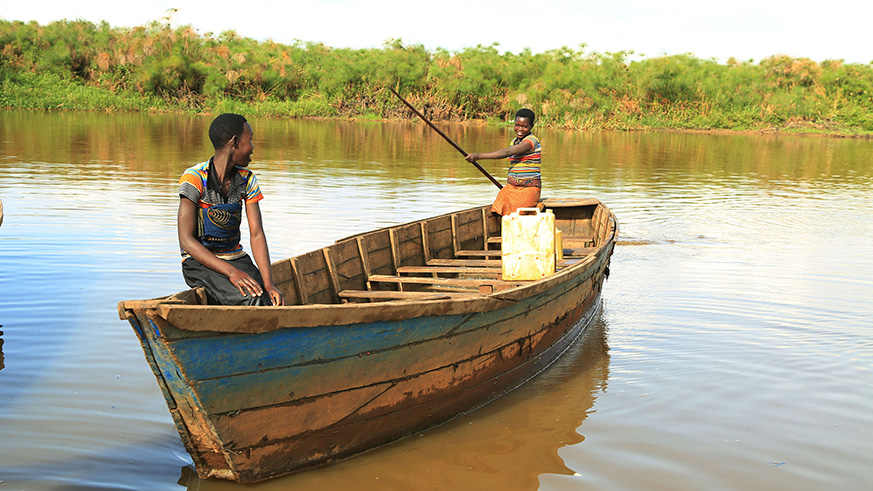Young girls fishing in Lake Rweru in Bugesera District last week.  Sam Ngendahimana.