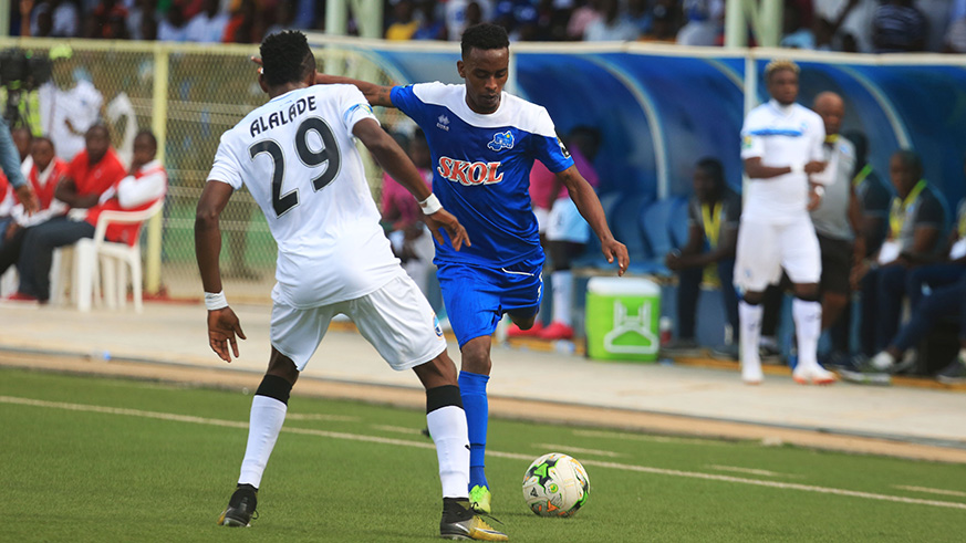 Left back Eric Rutanga tries to go past Enyimba's Wasiu Alalade