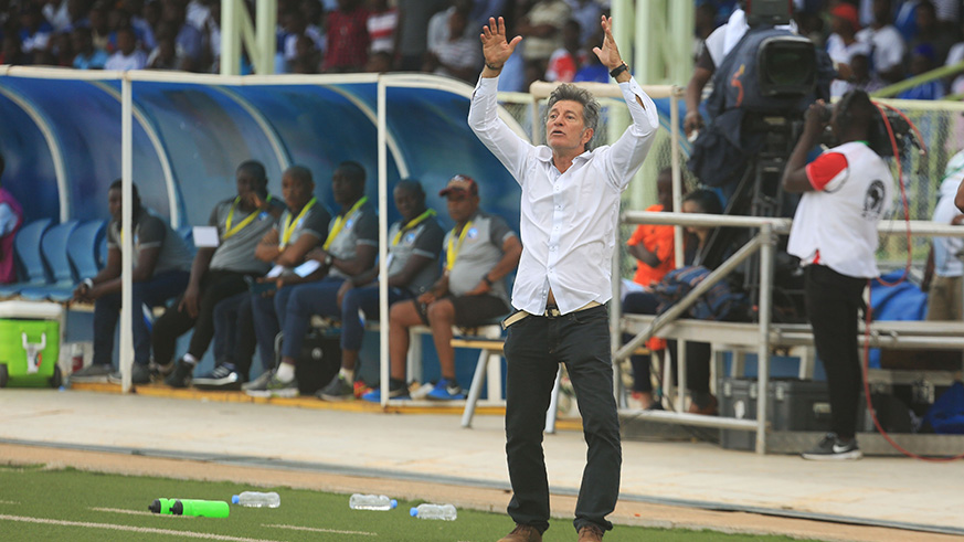 Rayon Sports head coach shouts to the players during the match
