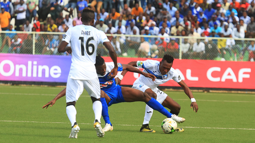 Rayon Sports' midfielder Prosper Kuka battles for the ball with Enyimba defender Udo Utin