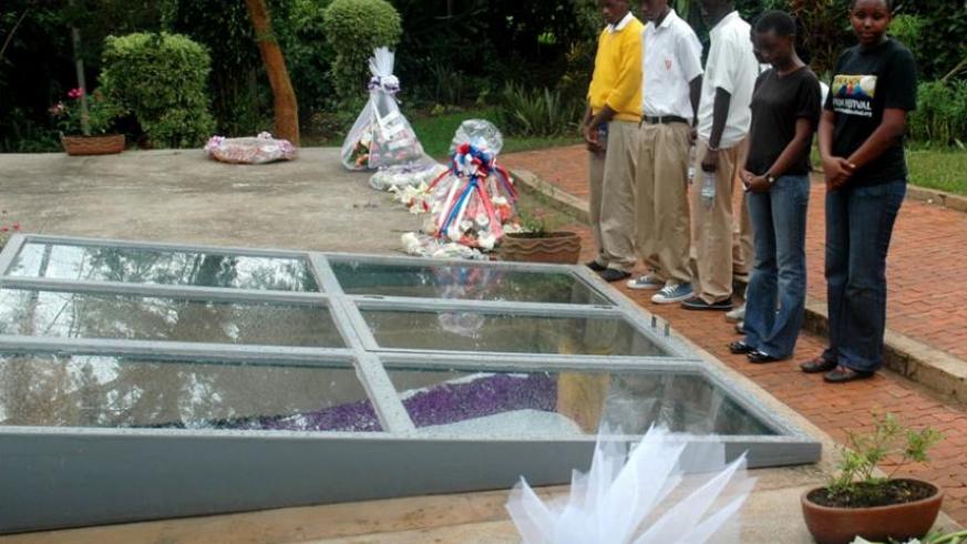 Students pay their respects by a mass grave at Kigali Genocide Memorial Centre, Gisozi. File.