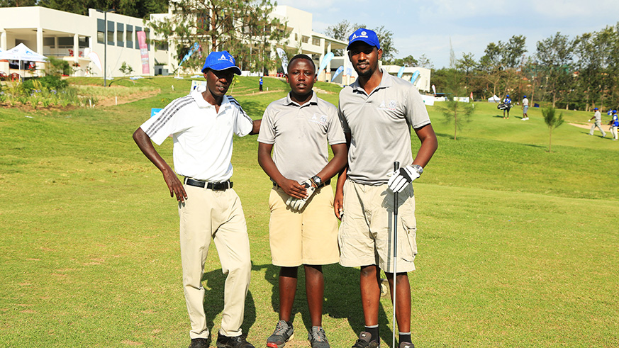 Last men on the teebox ,Paul, Aloys Nsabimana and Isah Byarugaba pose for a photo during CIMEGolf Tournament 2018 at Kigali Golf Club  on Saturday (Sam Ngendahimana)