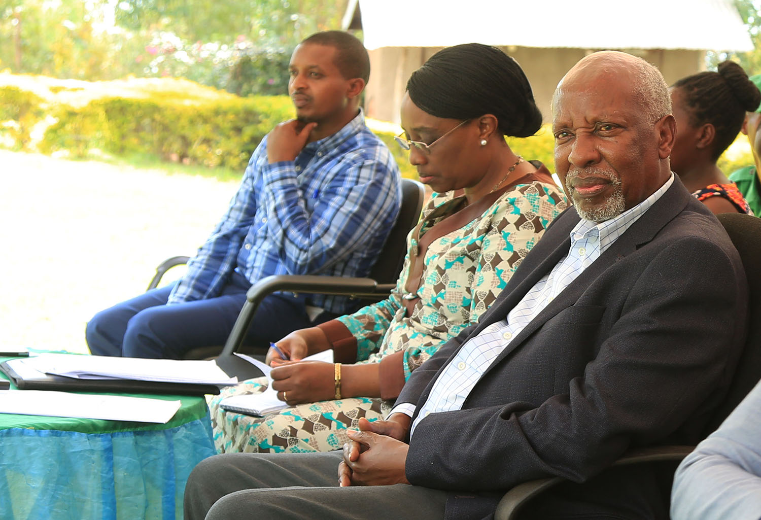 Senators Prof Emmanuel Bajyana (right) and Jacqueline Muhongayire listen to residents in Bumbogo Sector in Gasabo District on Day 1 of the consultations about democracy yesterday. Sam Ngendahimana.