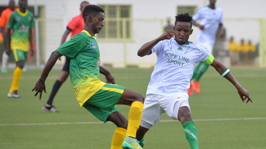 Evode Ntwali (left) is seen here vying for the ball with former Kiyovu SC skipper Fabrice Mugheni in  past league match at Kigali Stadium. File photo.