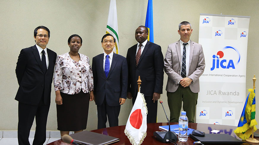 Officials pose for a group photo after signing the agreement between Japan and Rwanda yesterday (Sam Ngendahimana)