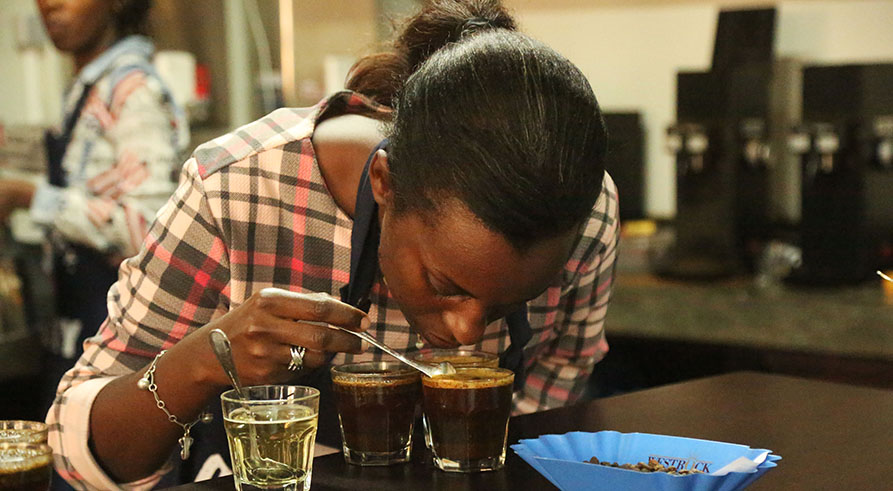 A taster at Rwanda Trading Company tastes coffee in a past cupping event at the Kigali Special Economic Zone in Gasabo District. Rwandan coffee has continued to attract global attention if the outcome yesterdayu2019s online auction is anything to go by. During the auction, 25 tonnes of coffee, that won the 2018 Cup of Excellence Award, fetched over $359,000. Sam Ngendahimana.