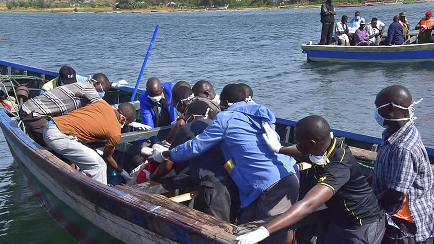 Rescuers retrieve a body from the water near Ukara Island in Lake Victoria, Tanzania Friday, Sept. 21, 2018. Net.