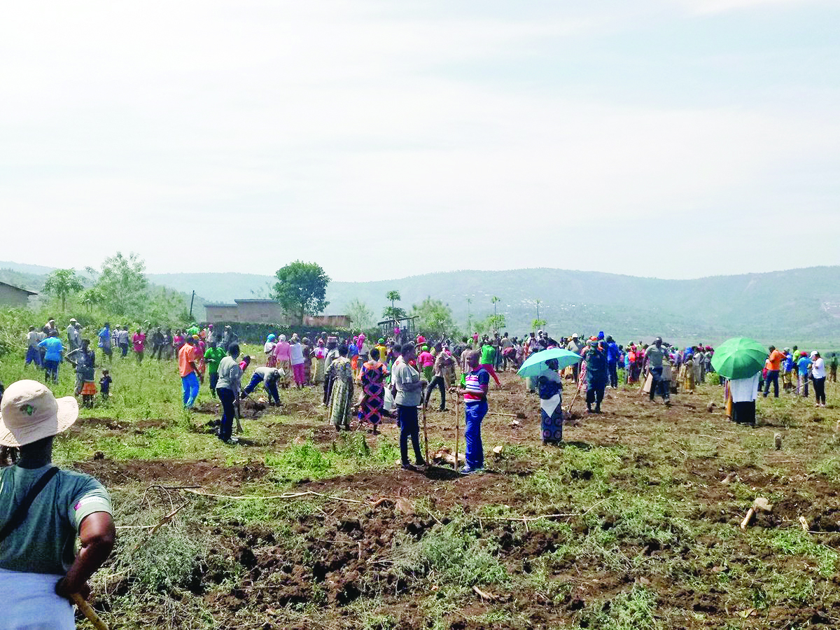 Stakeholders and residents levelling the plots where the other part of village will be constructed.