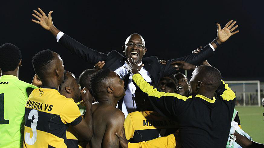 Mukura VS head coach Francis Haringingo is lifted in the air by his players after guiding the club to the Peace Cup title last month. File photo.