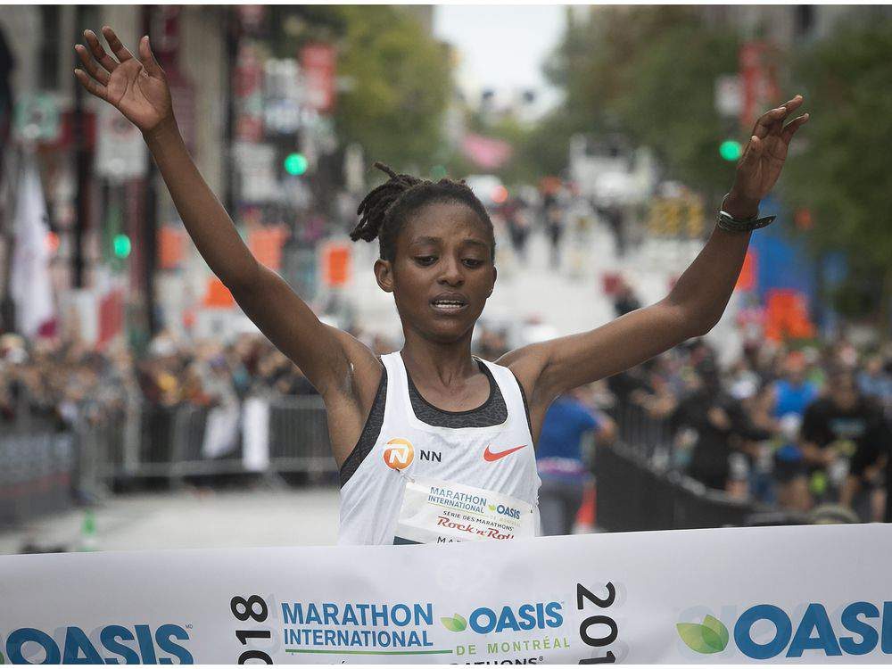 Salome Nyirarukundo, 20, celebrates after crossing the finish-line in Montreal, Canada yesterday. It was her maiden appearance in the annual event. Courtesy