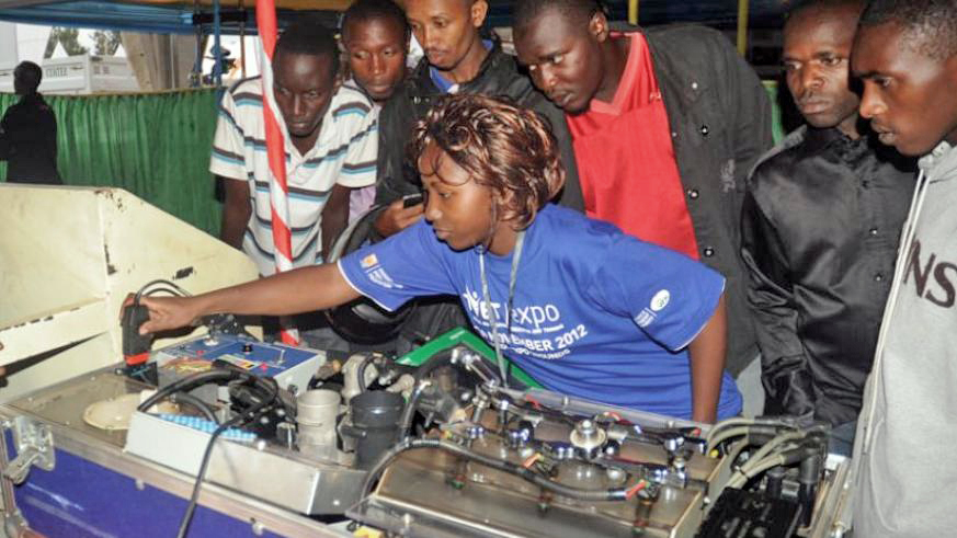 A student of mechanical engineering explains how an engine works during a TVET expo in Kigali in 2012. File.