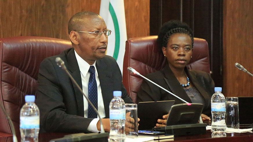 Central Bank Governor John Rwangombwa, addresses the news conference, as Monique Nsanzabaganwa, Vice Governor, looks on in Kigali yesterday. Sam Ngendahimana.