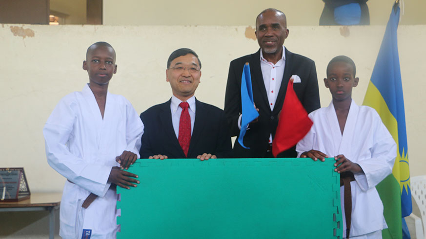 Japanese Ambassador to Rwanda, Takayuki Miyashita (2nd left) and Ferwaka president Theogene Uwayo (2nd right) pose at the event at Lycee de Kigali on Sunday. Courtesy.