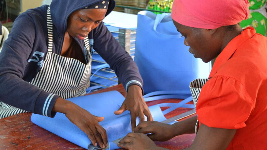 Women are encouraged to work together to promote woman to woman empowerment. Below: Female moto-drivers in Rwanda. Courtesy photos  