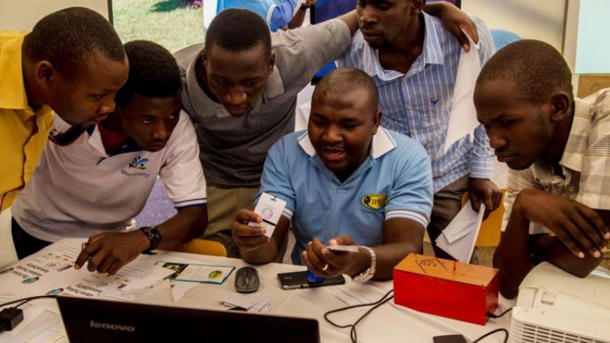Students of the University of Rwanda's College of Science and Technology view a system of tracking day scholers during the Kigali Innovation fair for education in March 2016. File.