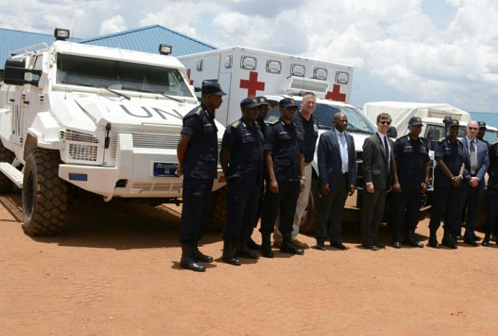 Senior police officers and other officials during the handover of the equipment that will help RNP during pre-deployment training before being dispatched for peacekeeping missions