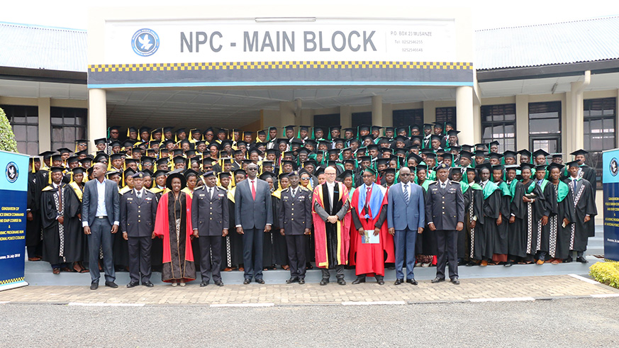 Police graduates in various academic disciplines take a group photo with senior Government officials, RNP and University of Rwanda leadership.