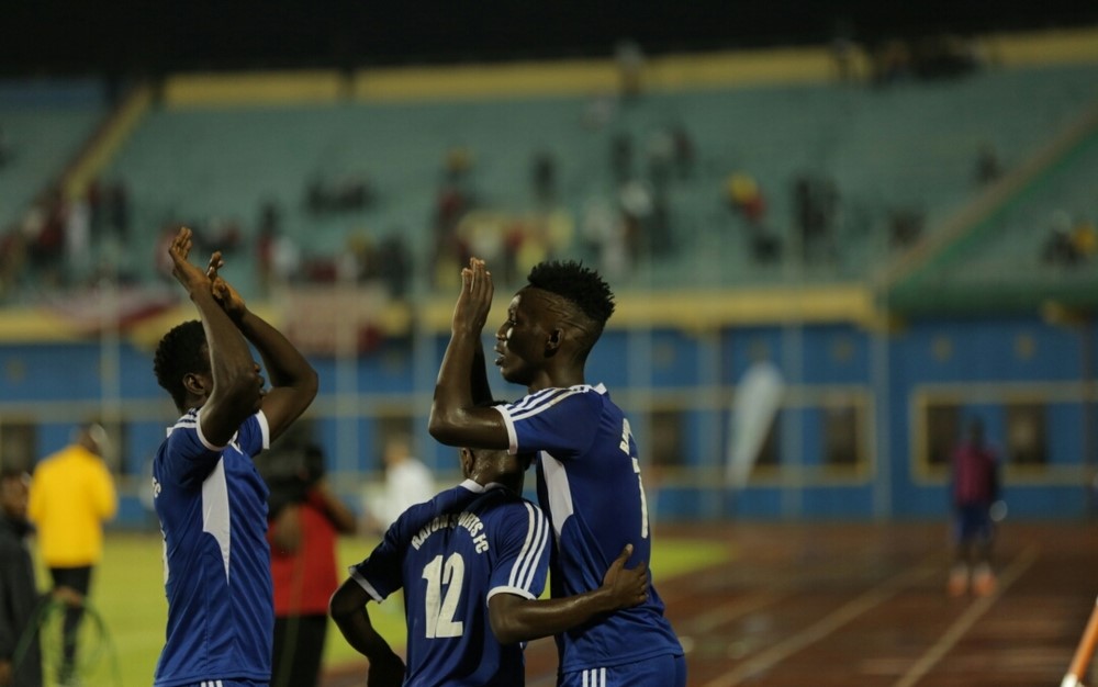 Burundian striker Bonfils Caleb Bimenyimana (right) celebrates his Rayon Sports teammates after scoring his second goal against AS Kigali at Amahoro Stadium on Friday. Courtsey.