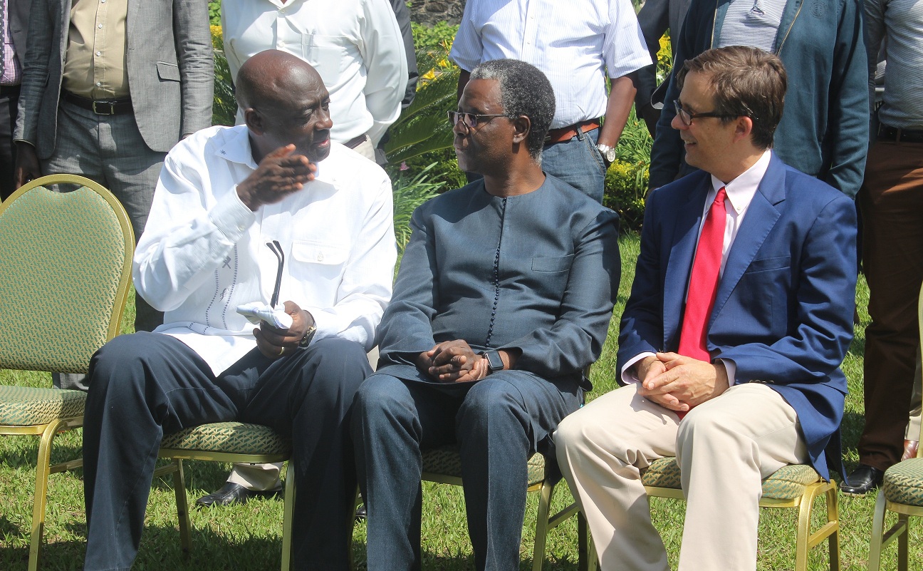 Busingye (left) chats with Ndiaye and Peter Vrooman, the US ambassador to Rwanda (right) in Rubavu District yesterday. Regis Umurengezi.