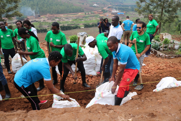 A group of youth from different countries on the continent during Umuganda yesterday. Frederic Byumvuhore.