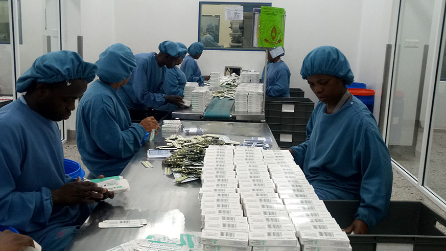 Employees of Cosmos pharmaceutical company packing medicines in Kenya. Officials say they can produce more medicines if they are supported. Jean du2019Amour Mbonyinshuti.