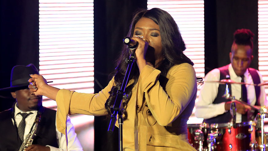 During her performance, Waje joined this fan in his seat to sing for him. (Faustin Niyigena)
