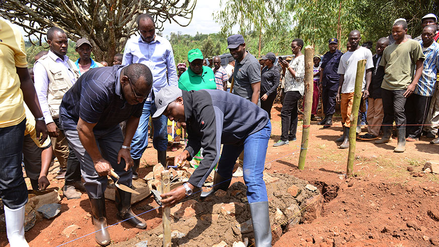 Prime Minister Edouard Ngirente (right) and Infrastructure Minister Claver Gatete lay a foundation stone for the construction of 12 classrooms at Groupe Scolaire Rukomo during Umuganda in Nyagatare District yesterday. Courtesy.