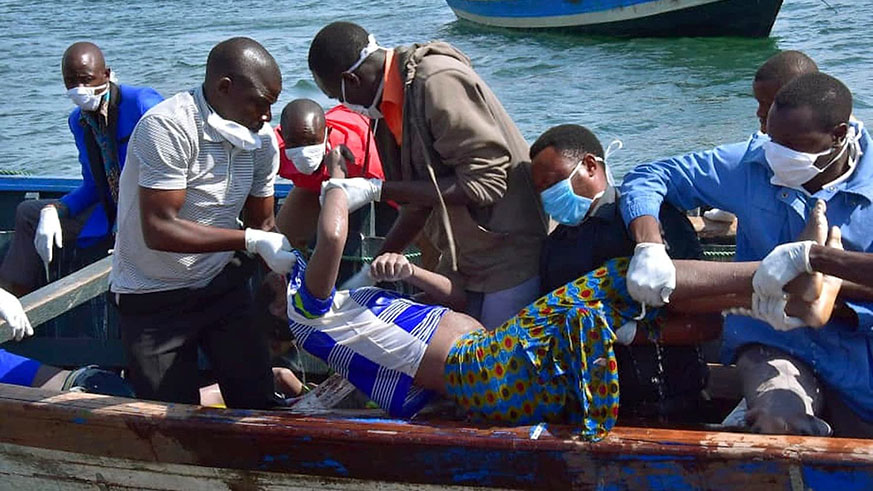 Rescuers retrieve a body from the water near Ukara Island in Lake Victoria, Tanzania Friday, Sept. 21, 2018. Net.