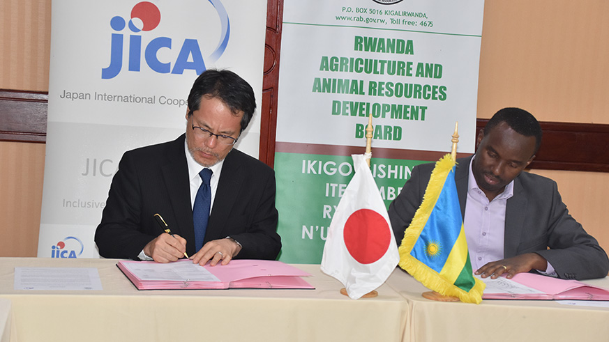 JICA's Chief Representative Hiroyuki Takada and Dr Patrick Karangwa, the Director General of RAB, signing the deal. Frederic Byumvuhore. 