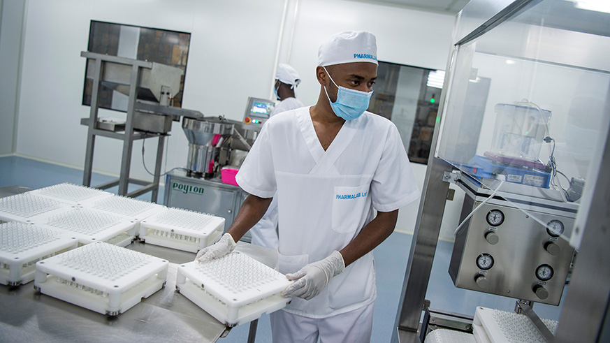 A staffer at PharmaLab at the Special Economic Zone in Kigali. File.