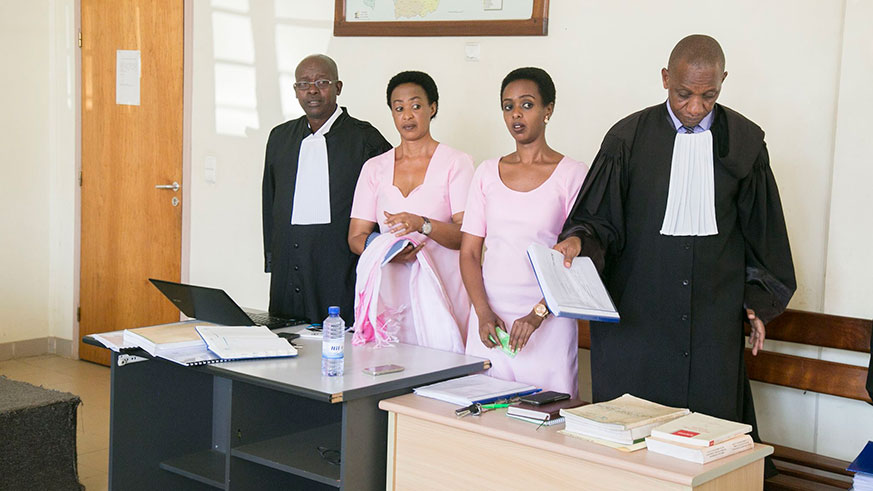 Diane Rwigara and Adeline Mukamugemanyi-Rwigara with their lawyers at High Court on Tuesday. / Courtesy