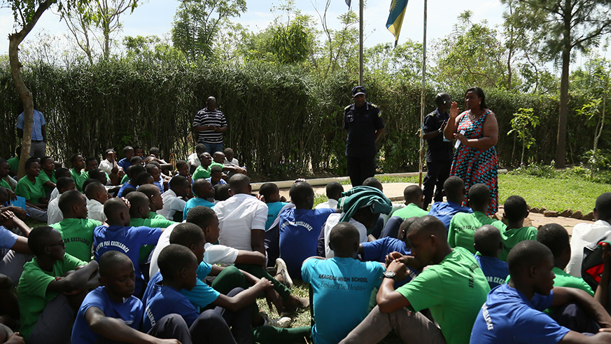 Juliet Murekatete, the vice mayor of Nyagatare in-charge of Social Affairs, and the DPC SSP Pierre Tebuka address students of Akagera High School in Nyagatare. Courtesy
