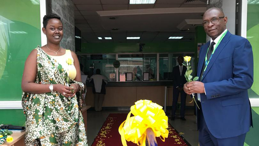 KCB Bank Rwanda MD,George Odhiambo kicked off the customer services week by welcoming customers with gifts on a red carpet experience at the KCB headquarters in town. Photos by Joseph Mudingu.