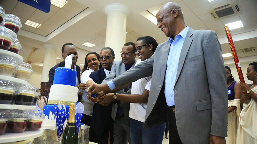Bank of Kigali CEO Diane Karusisi (2nd-right) leads other officials to cut cake during the celebration of Customer week yesterday(Sam Ngendahimana)