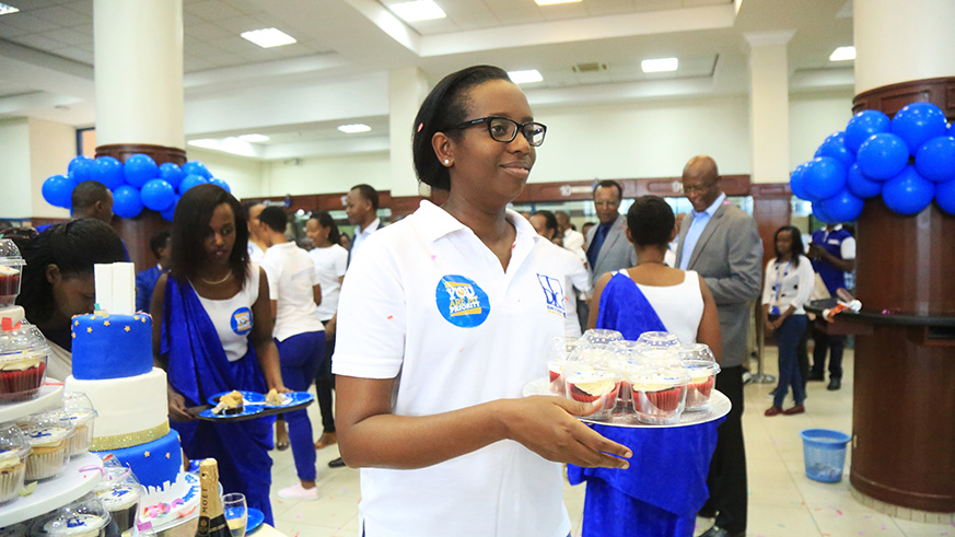 Bank-of-Kigali-CEO-Diane-Karusisi-serving-customers-in-the-ceremony.