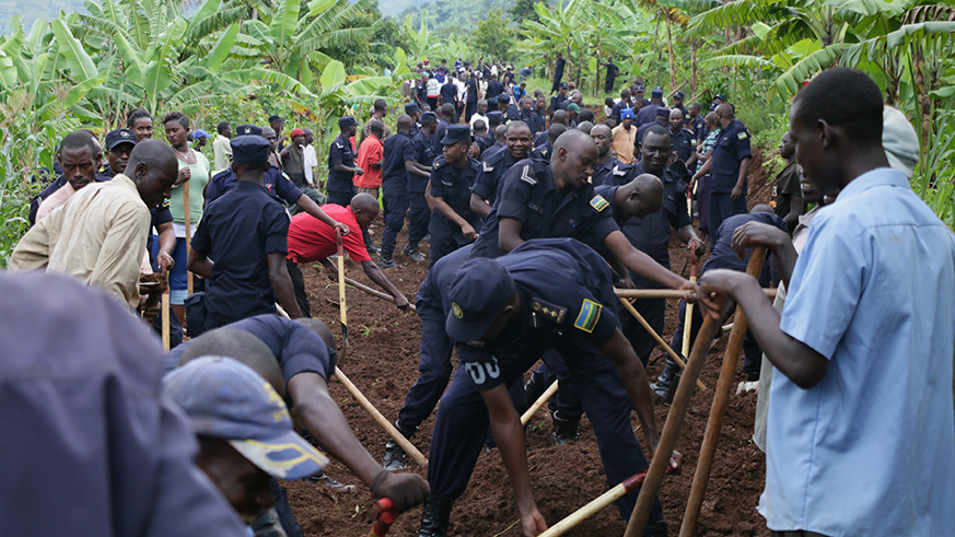 Police officers creating a road connecting communities during u2018Police Weeku2019 2017. Courtesy.