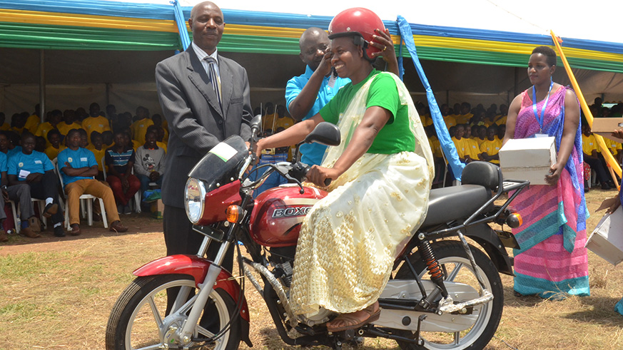 The-best-teacher-in-Eastern-Province-Rachel-Nyirazanazose,-sitting-on-a-brand-new-motorcycle.-She-teaches-at-GS-Karenge,-Rwamagana-District.