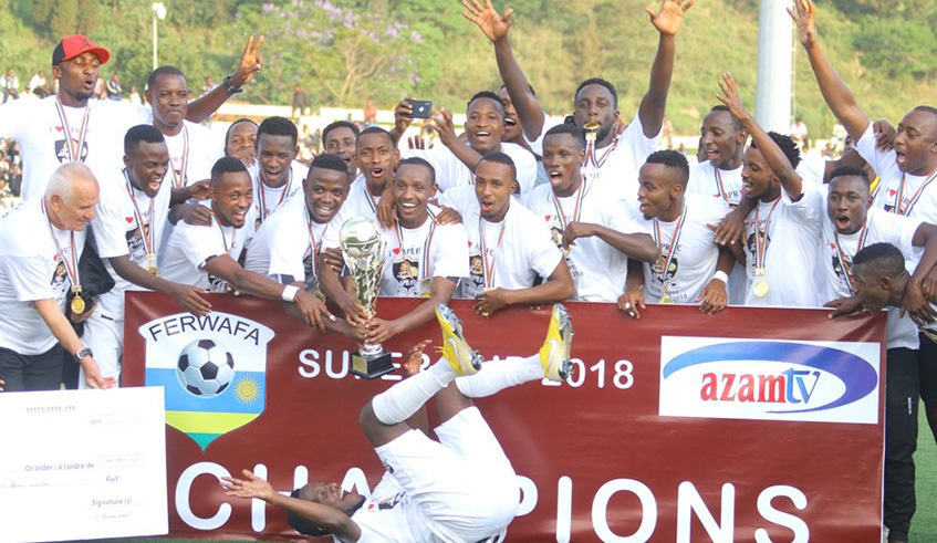 APR players and staff celebrate with the trophy and Rwf5M cheque after beating Mukura 2-0 to win this yearu2019s Super Cup title on Saturday afternoon at Umuganda Stadium in Rubavu District. Courtesy.