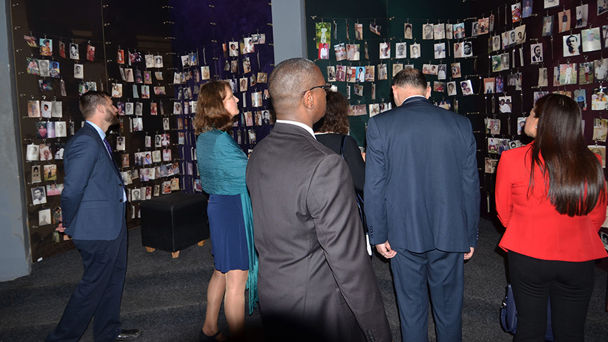 Visitors look at some pictures of victims of Genocide archived at Kigali Genocide Memorial. File.