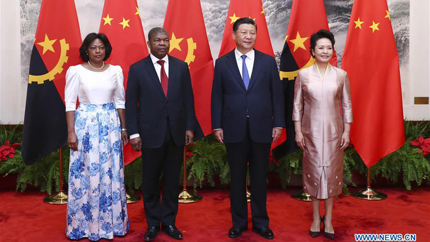 Chinese President Xi Jinping and his wife Peng Liyuan pose for a group photo with Angolan President Joao Lourenco and his wife in Beijing, capital of China