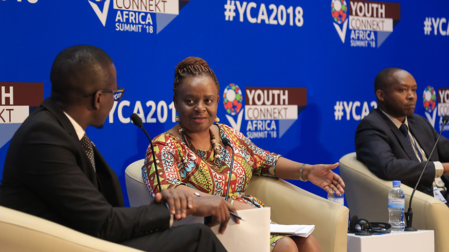 Dorothy Tembo, the Deputy Executive Director of International Trade Centre (centre),. makes a point during a panel discussion at the Youth Connekt Summit as moderator Georgie Ndirangu (left) and Maurice Toroitich, BPR Atlas Mara Rwanda Managing Director, look on in Kigali yesterday. Nadege Imbabazi.