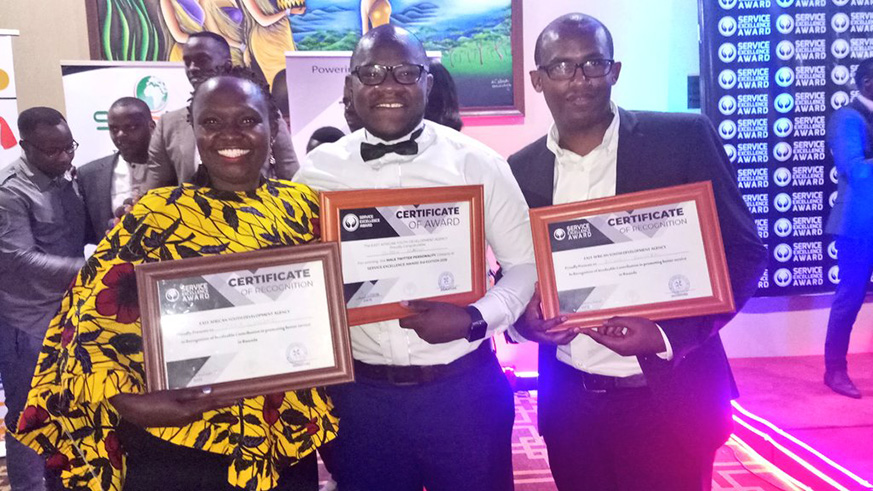 The writer with other winners of the service excellence awards. Net photo