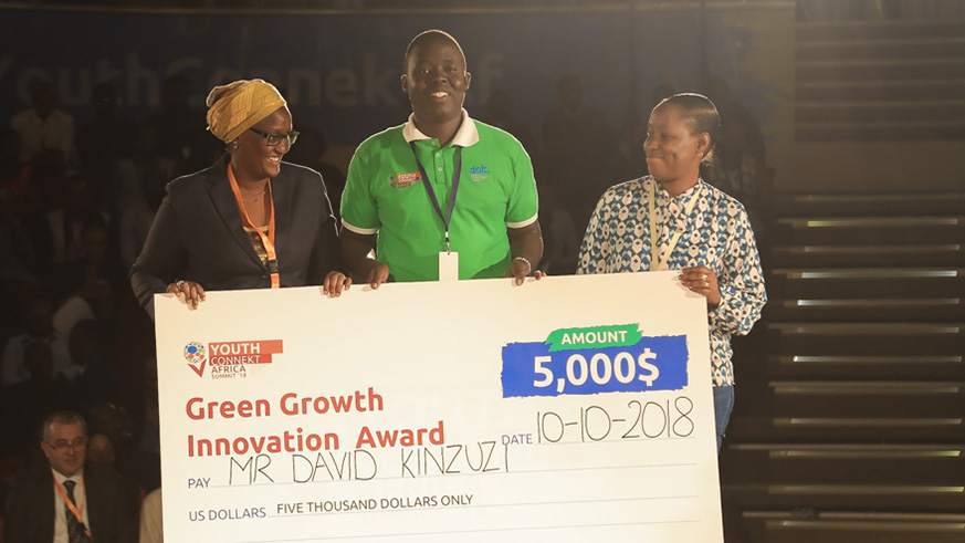 David Kinzuzi (centre) emerged the biggest winner and was awarded for his u201cMy Green Home Projectu201d at the just-concluded Youth Connekt Africa Summit in Kigali yesterday. Nadege Imbabazi.