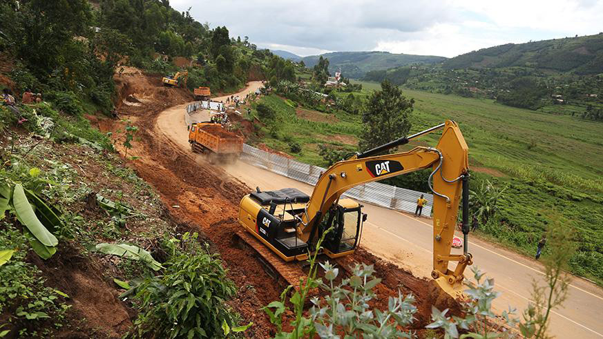 Construction works on a section of the Kigali-Gatuna highway, in Gicumbi District, which was destroyed by landslides in May this year.  It is such disasters that  cost the economy a staggering Rwf204 billion in the first six month of this year. File
