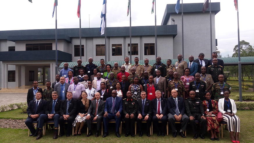 Participants of the African Integrated Crisis Management Course  pose for a group photo together with other officials. Photo/Regis Umurengezi