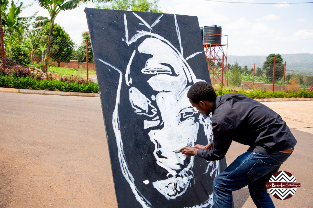 An artist displays his dexterity by making a live portrait during the contest.