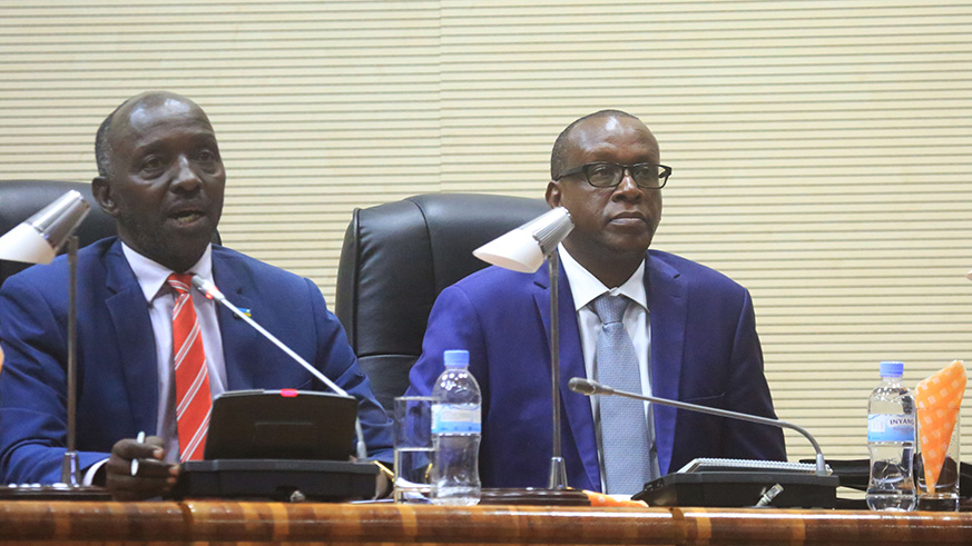 Dr Emmanuel Havugimana and Dr Jean-Damascu00e8ne Bizimana, the CNLG Executive Secretary, address members of parliament yesterday. Sam Ngendahimana.